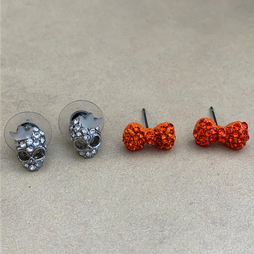 Crystal skull with tiara studs, orange bow studs. Brand new.
